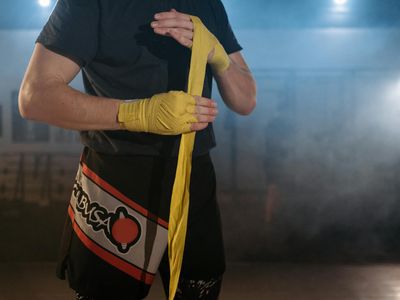 Close up of sports equipment and athlete preparing for workout