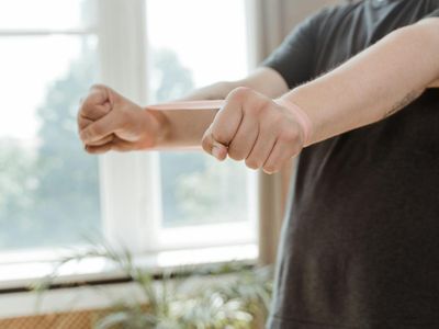 Man stretching his arms after a successful training session